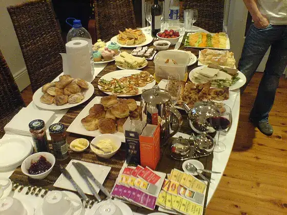A Swedish buffet table laid out with many different dishes.